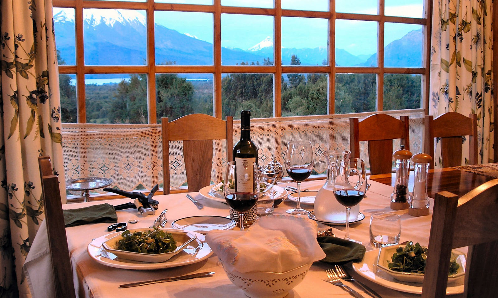 As you can appreciate in this photo, the view from the dinner table at Tres Rios includes two snowy volcanic peaks, a huge lake, and forests all around.